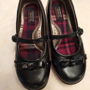 Black dress shoe with bows and buckle closure